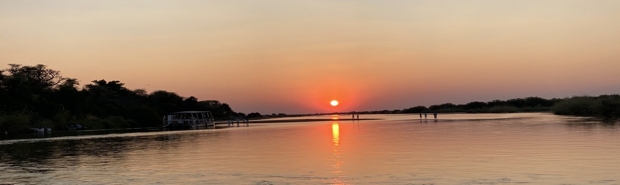 Boat in the horizon in a river in Namibia