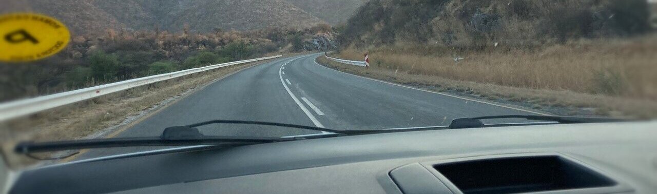 Vehicle moving towards the horizon in Namibia